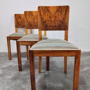 Set of six Art Deco dining chairs in walnut root veneer, 1940s.