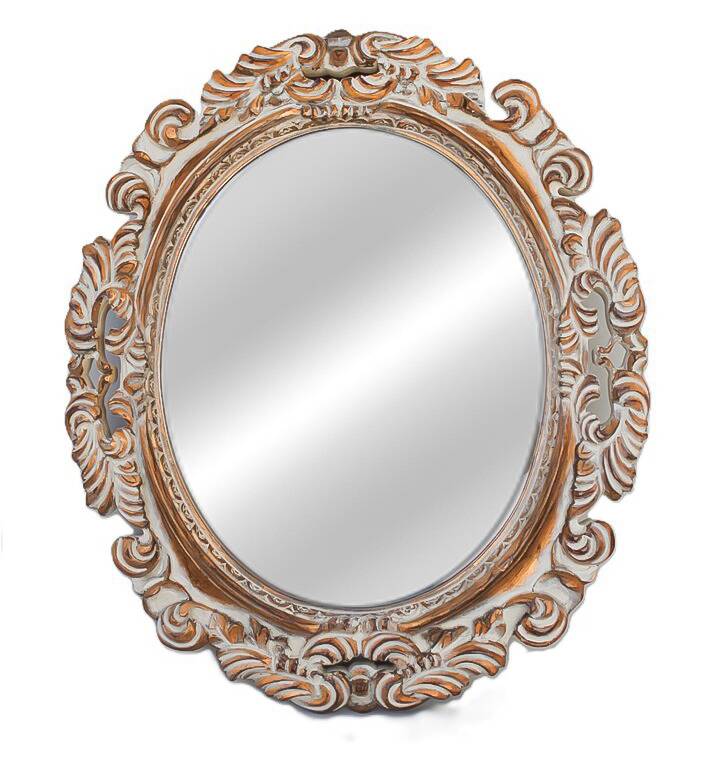 Distressed and carved golden oval mirror in wood.