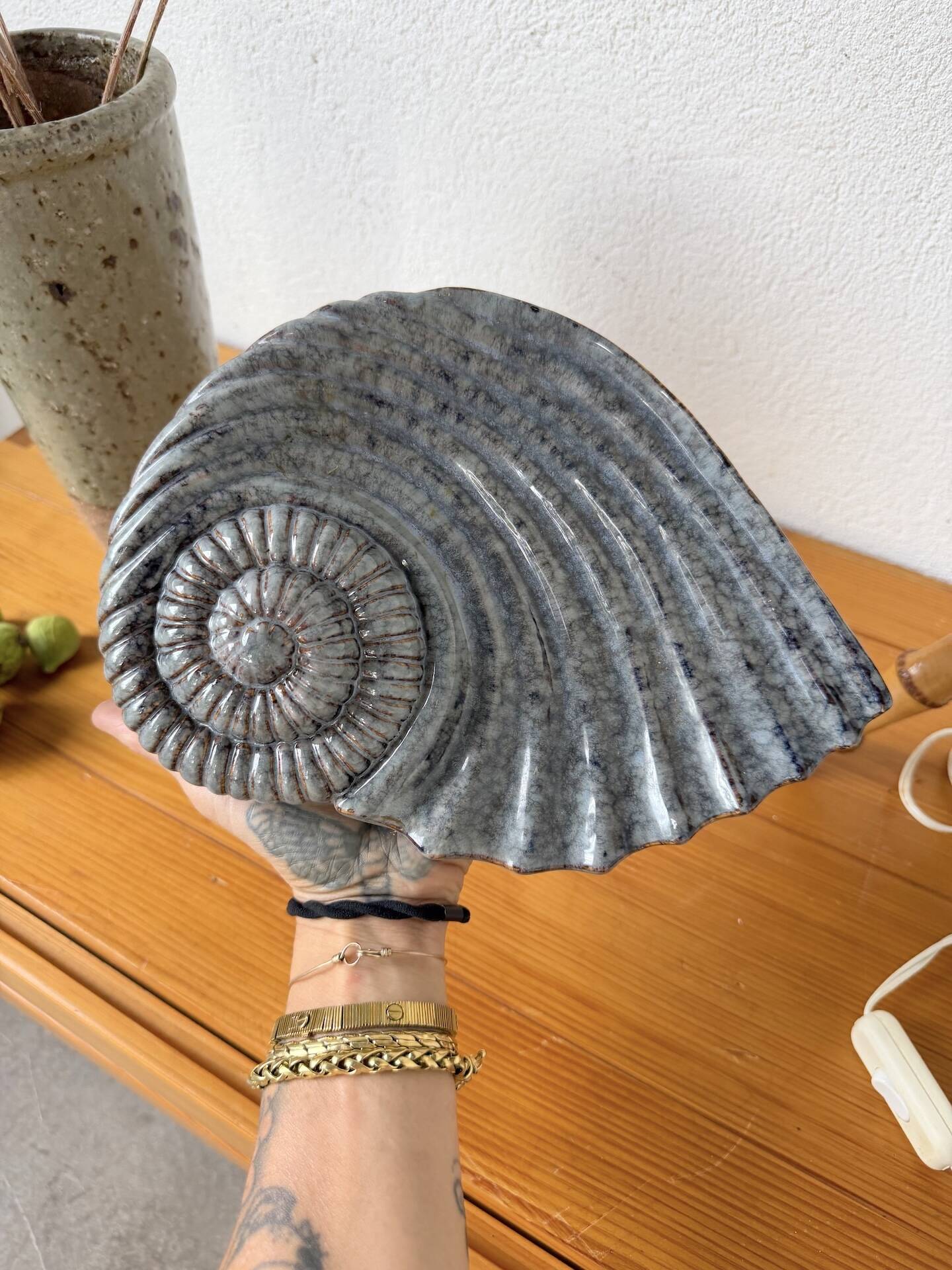 Shell-shaped ceramic catchall.