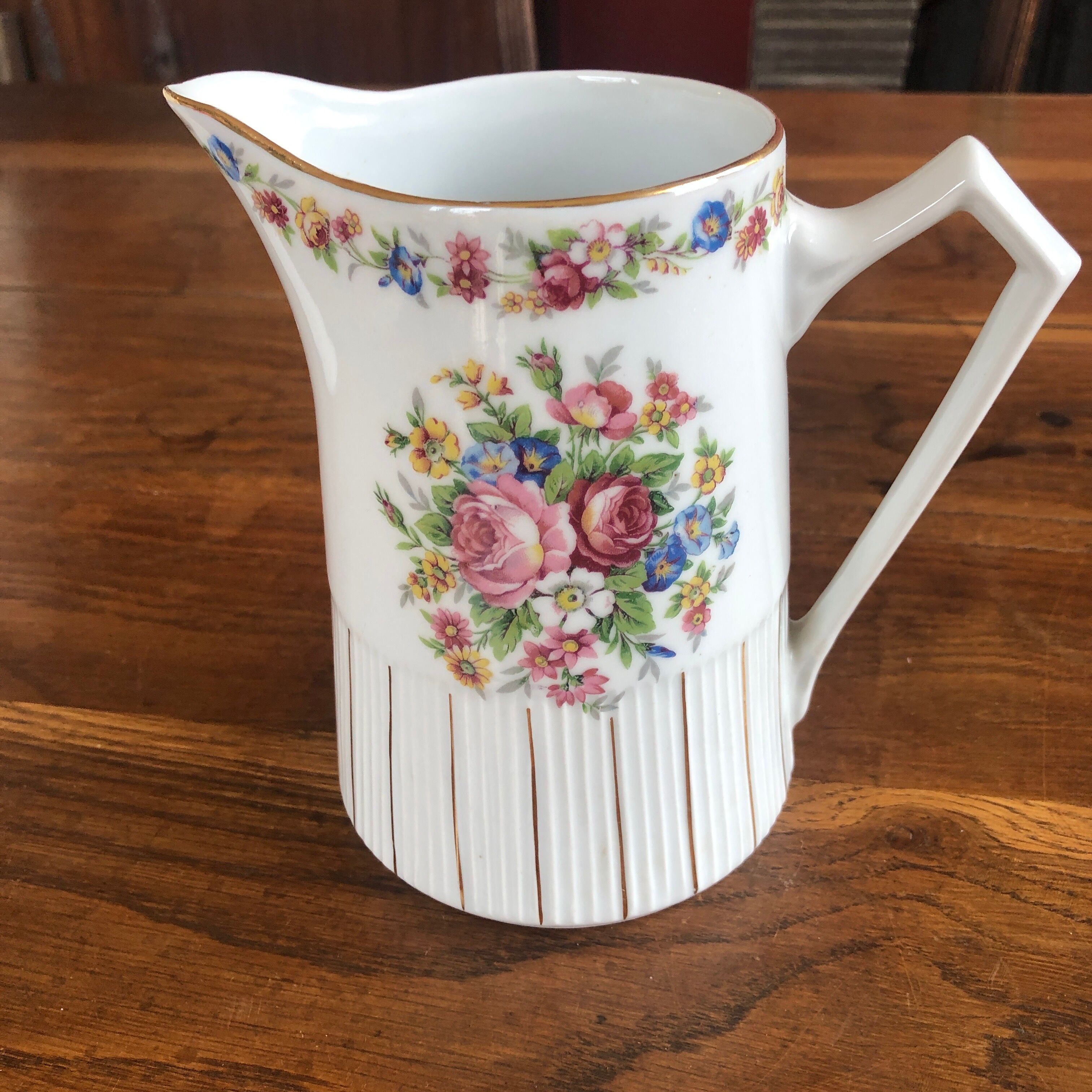 Porcelain pitcher with flowers