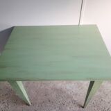 Green side table with tapered legs