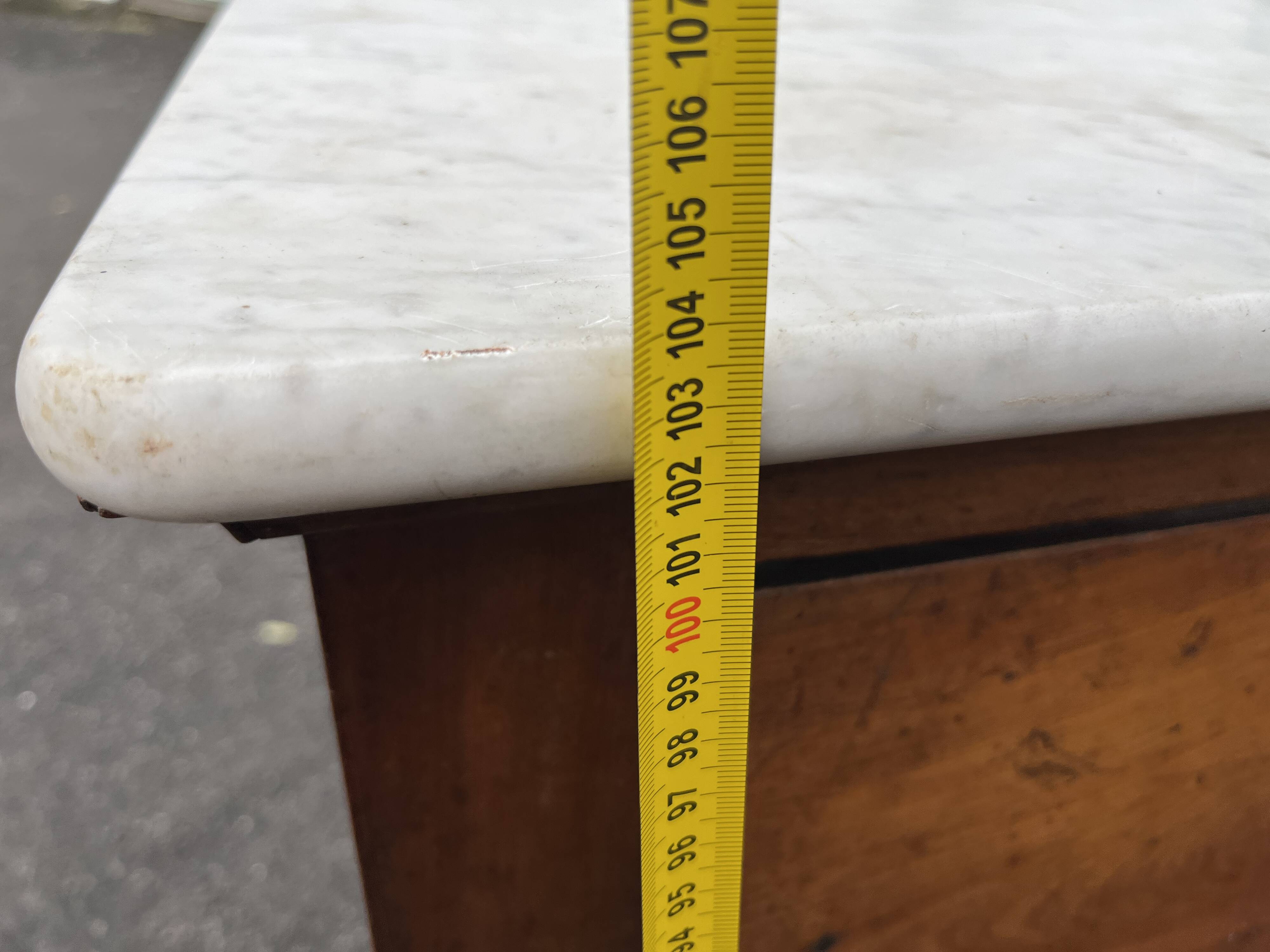 Antique 19th-century wooden chest of drawers with a marble top