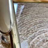 Dessert table with a cream-coloured metal structure and golden brass, 1960s.