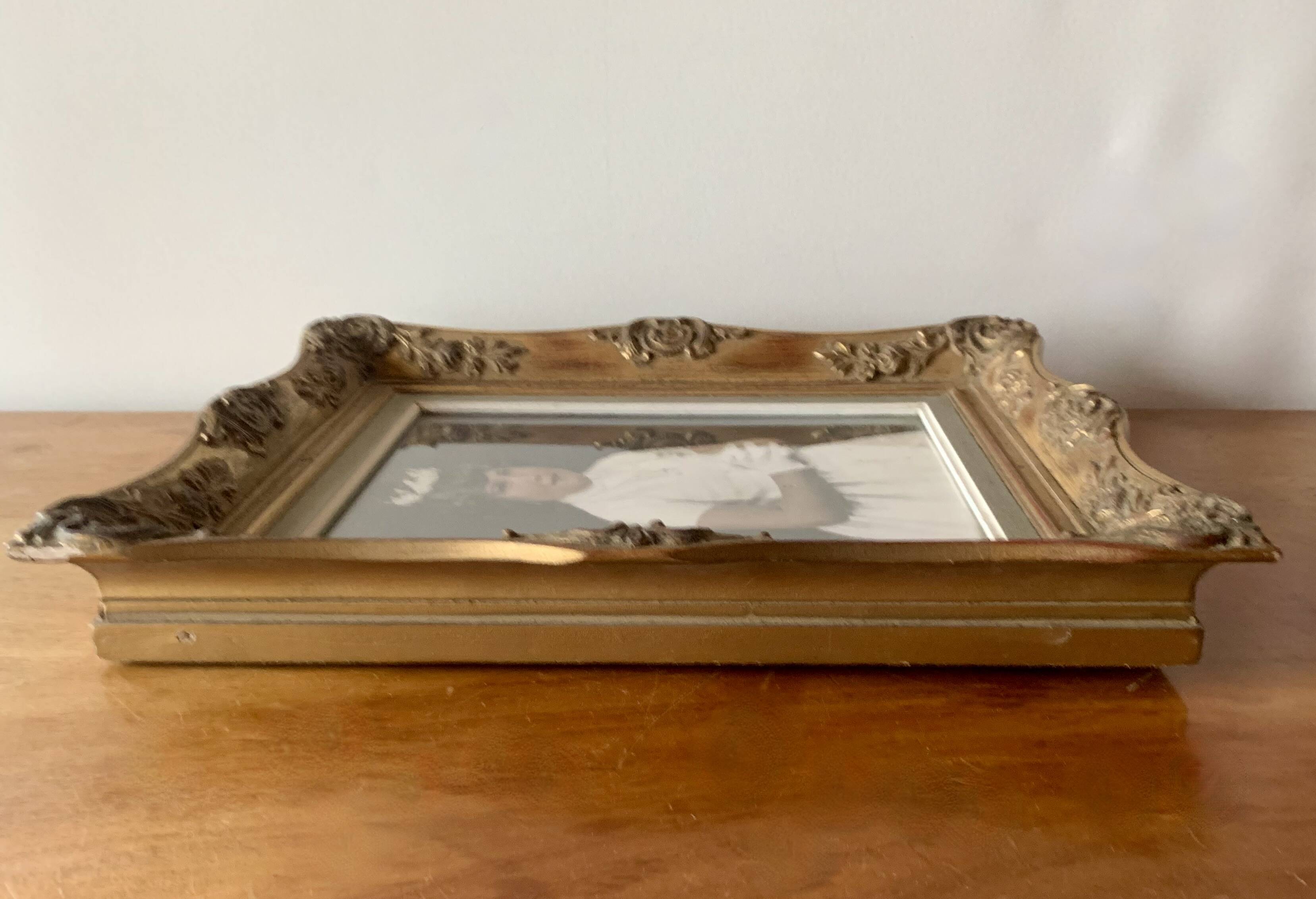 Old gilded carved wooden wall frame