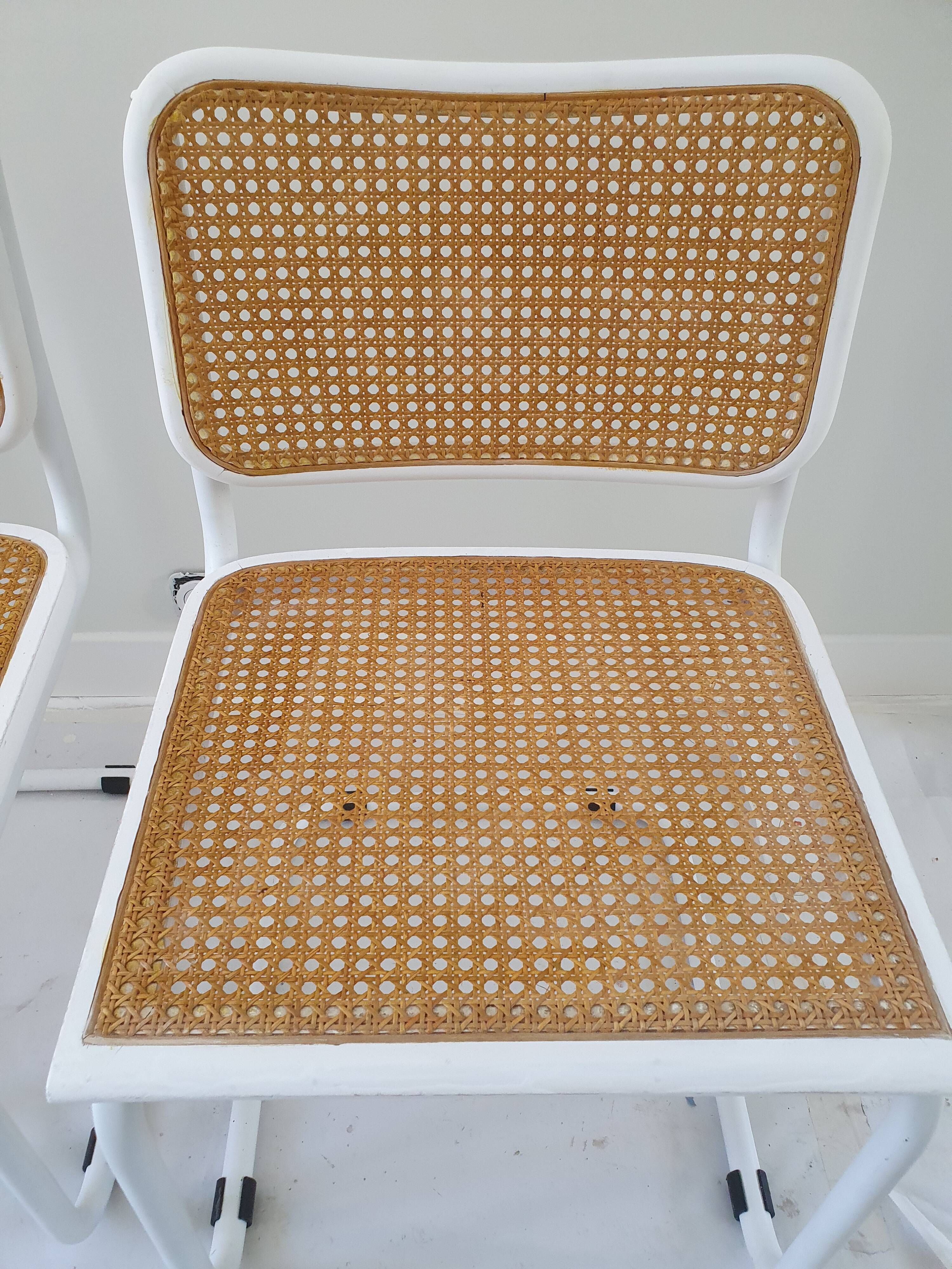 B32 chairs by Marcel Breuer in white.