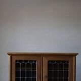 20th-century mid-century solid oak sideboard with glass front, by a Danish cabinetmaker.