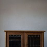 20th-century mid-century solid oak sideboard with glass front, by a Danish cabinetmaker.