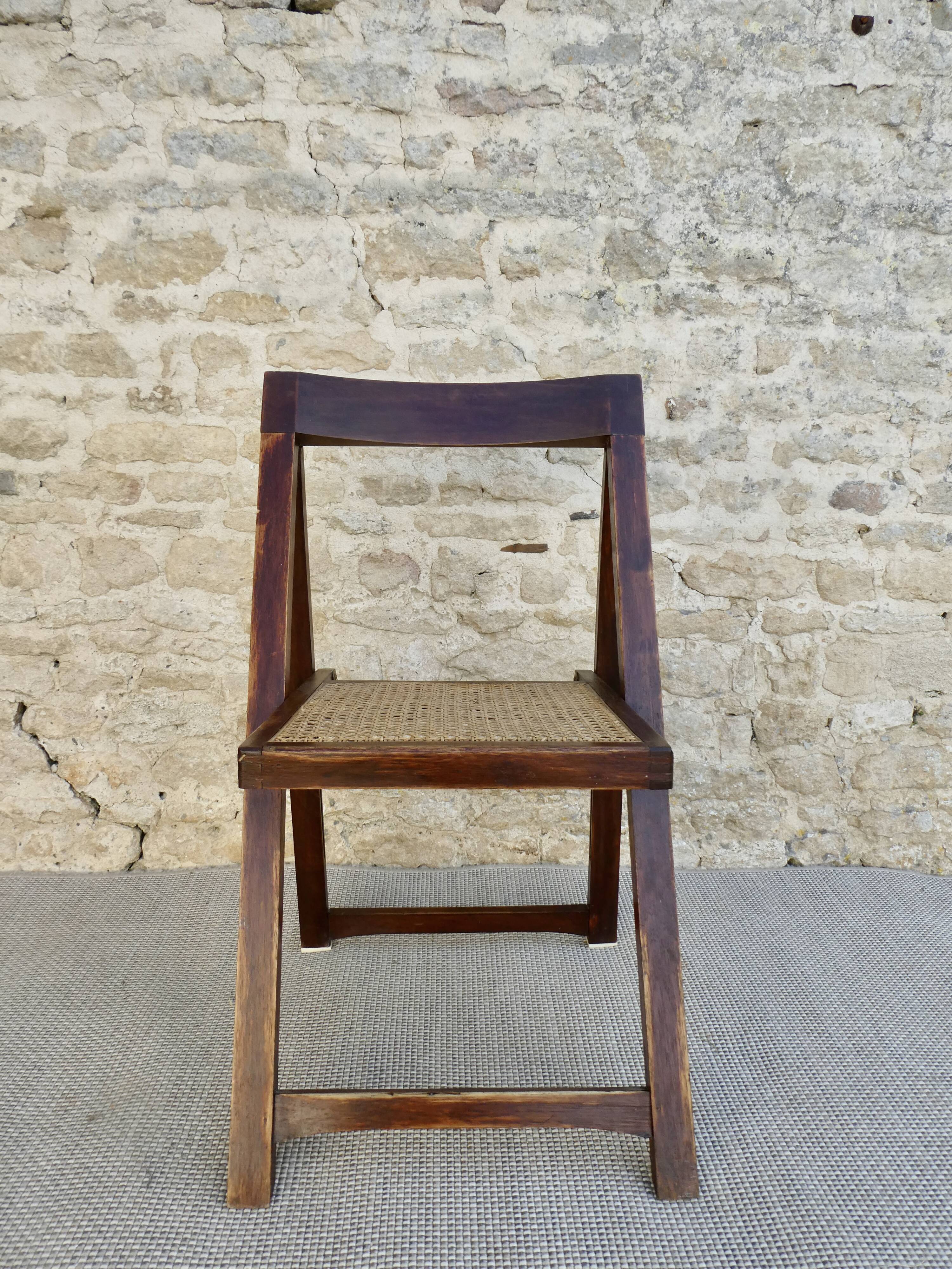 Wooden folding chair with caned seat