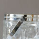 Vintage glass ice bucket stamped with a metal handle