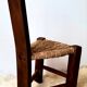 Brutalist tripod chair in solid wood and vintage straw from the 50s / 60s
