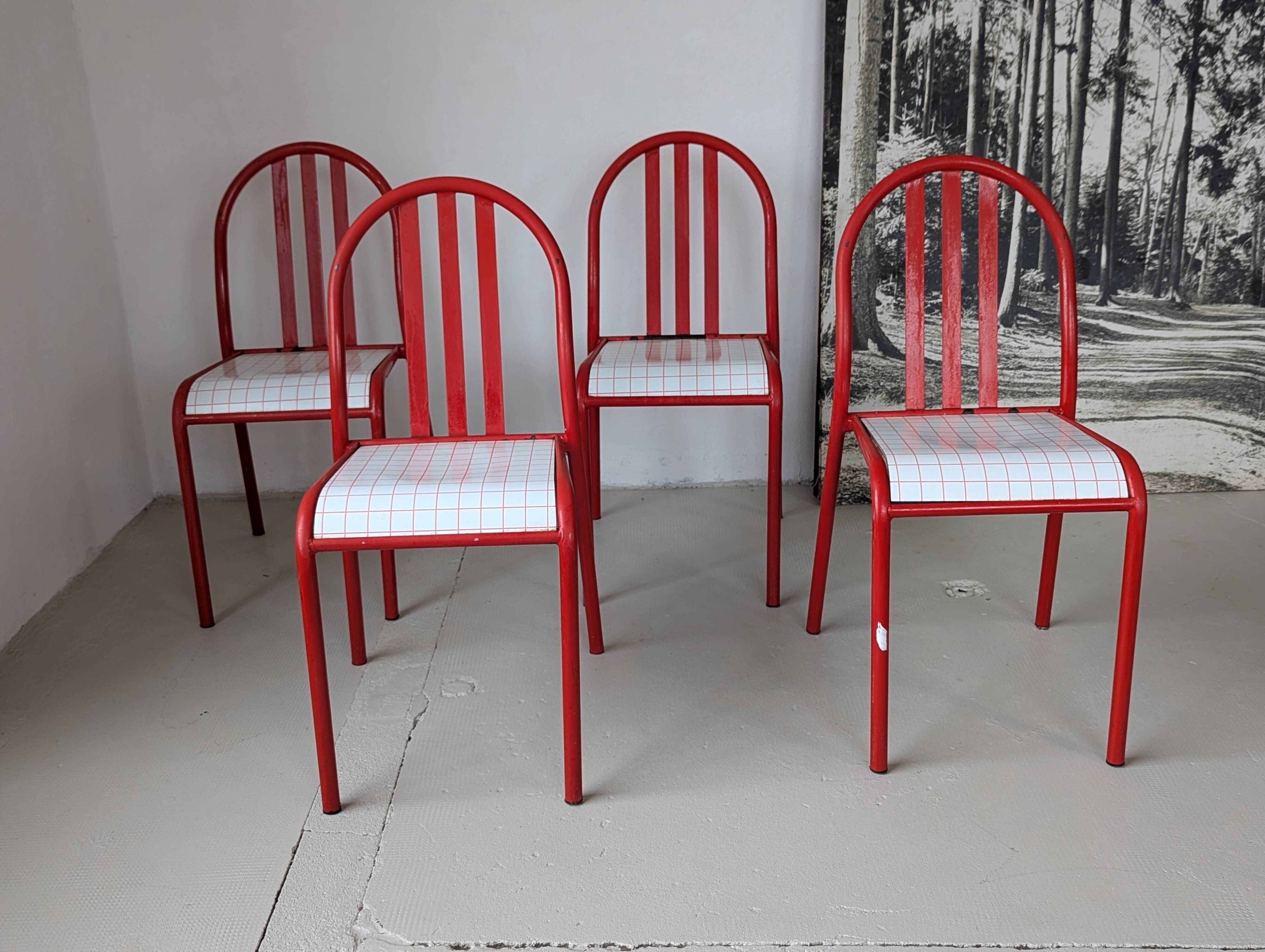 Set of 4 modernist red metal chairs