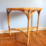 Half-moon rattan console