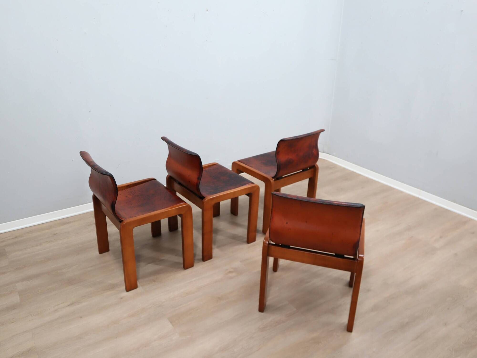 Curved wooden and leather chairs by Afra and Tobia Scarpa from the 1970s, set of 4.