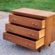 Vintage chest of drawers in golden oak from the 50s with 3 drawers and spindle-legged shelf