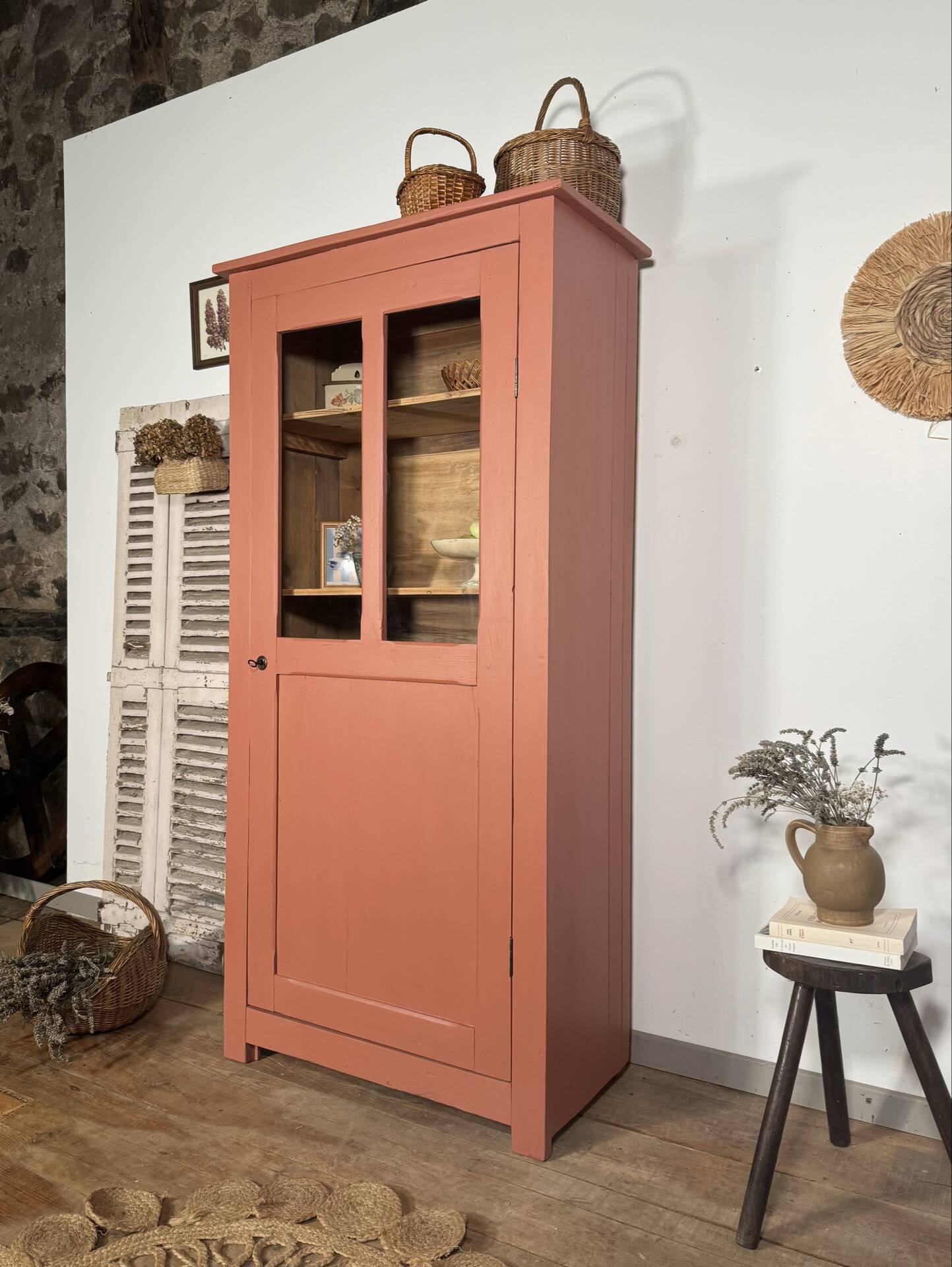 Antique glass-fronted terracotta cupboard