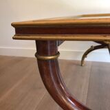 Coffee table in patinated and gilded carved wood with mirror top