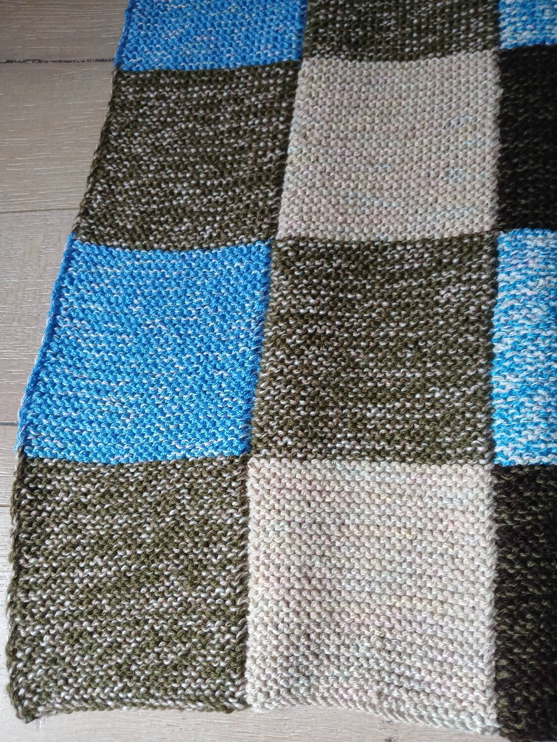 Hand knitted patchwork plaid