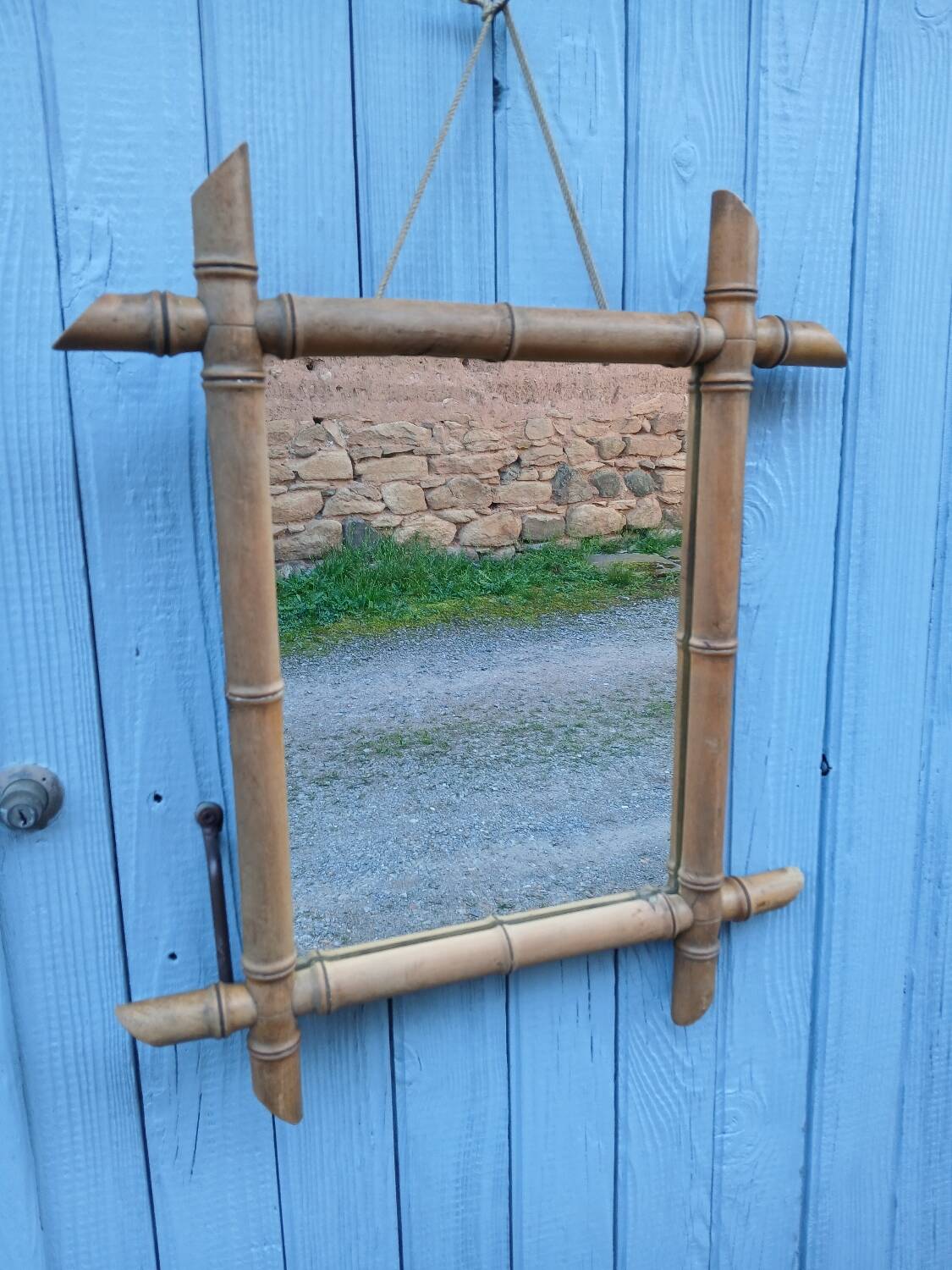 Antique wall mirror with a wooden frame