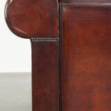 Luxurious and spacious two-seater sheepskin sofa of top quality with fabric cushions