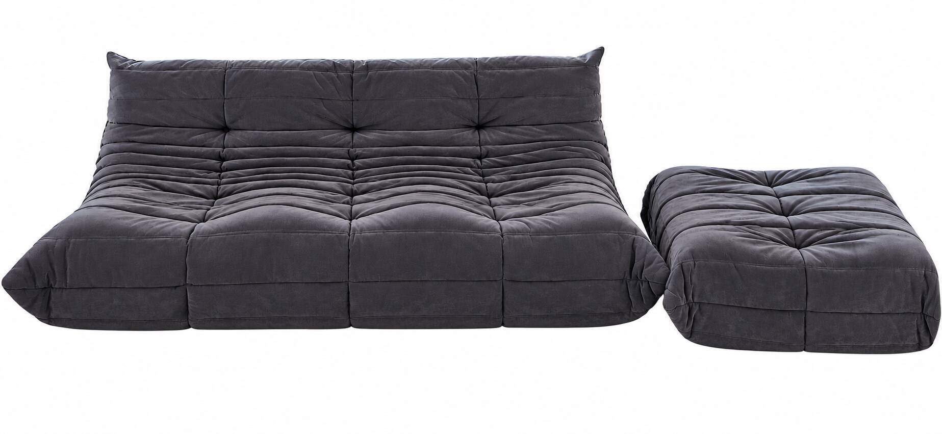 Togo 3-seater sofa by ligne roset with an ottoman.