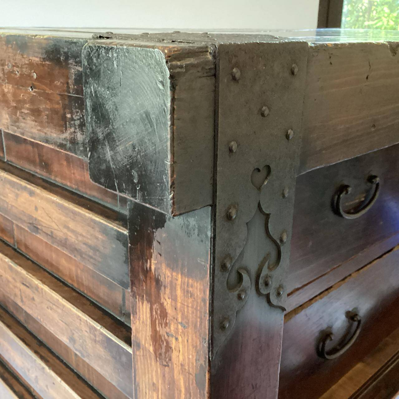 Japanese antique wooden chest with black fittings.