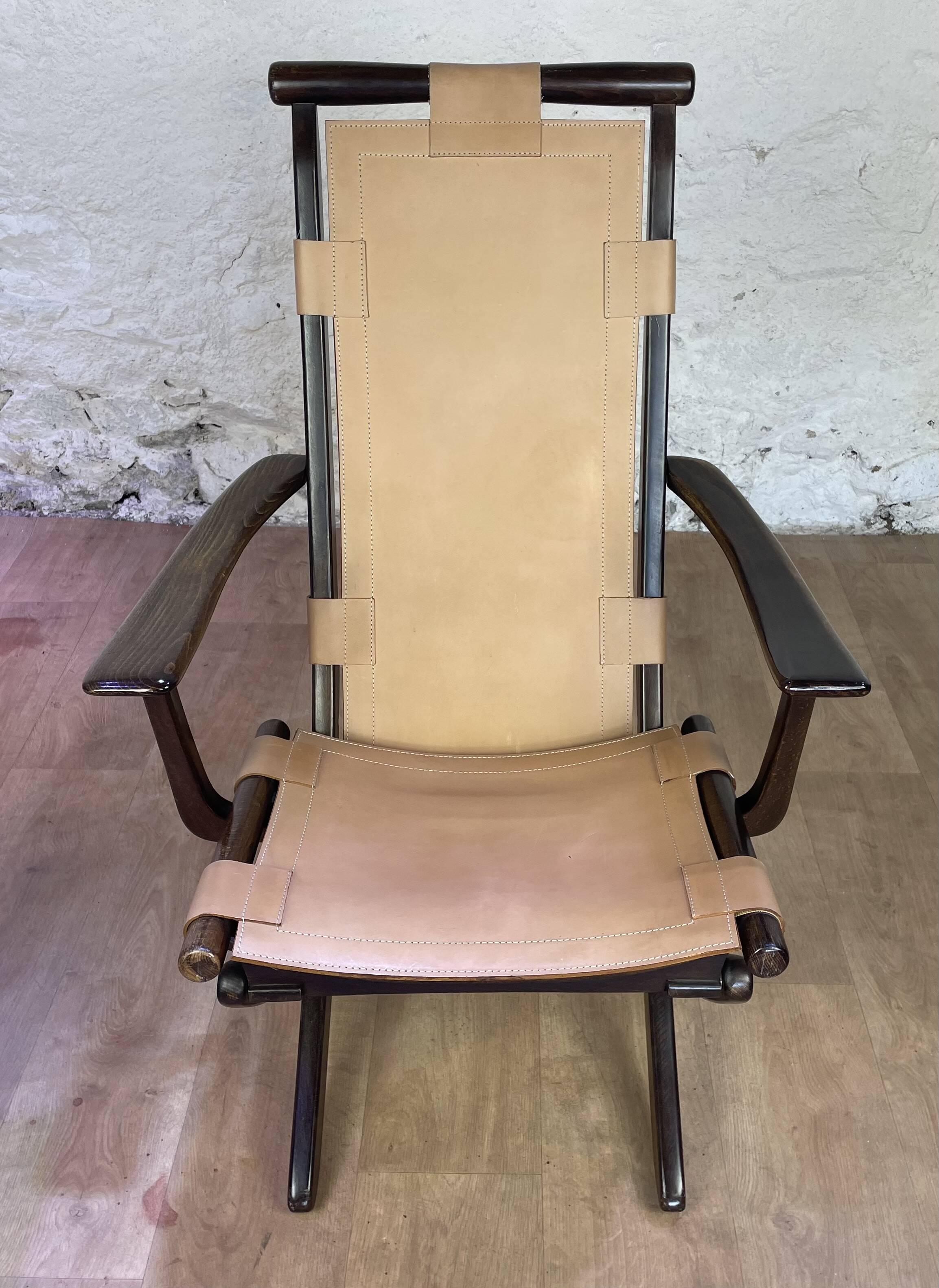 Colonial style leather armchair and ottoman