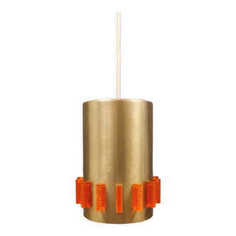 Stylish golden cylinder lamp made of aluminium with removable prisms of hard pressed orange glass