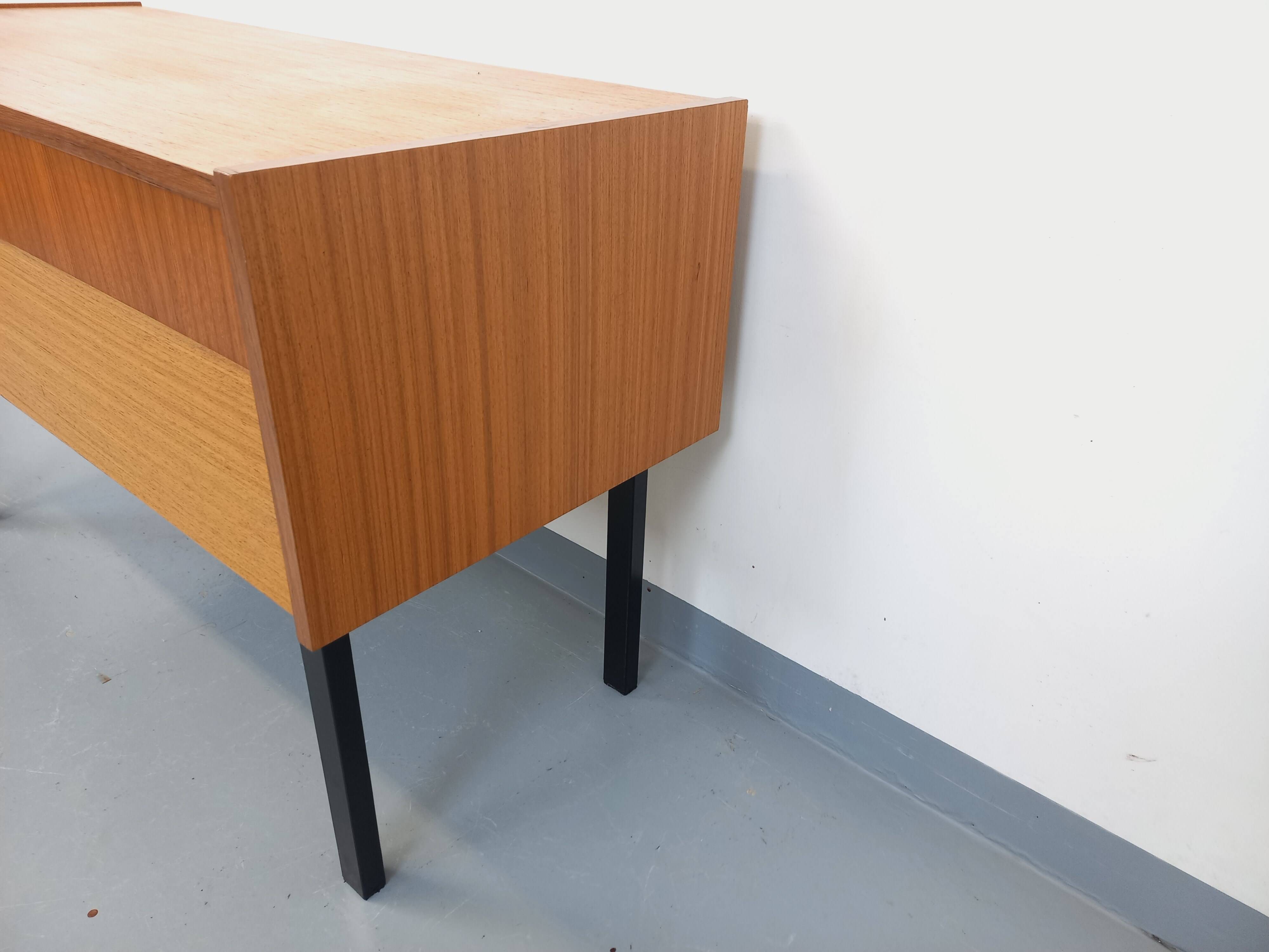 Vintage teak and black metal storage unit / chest on legs from the 70s