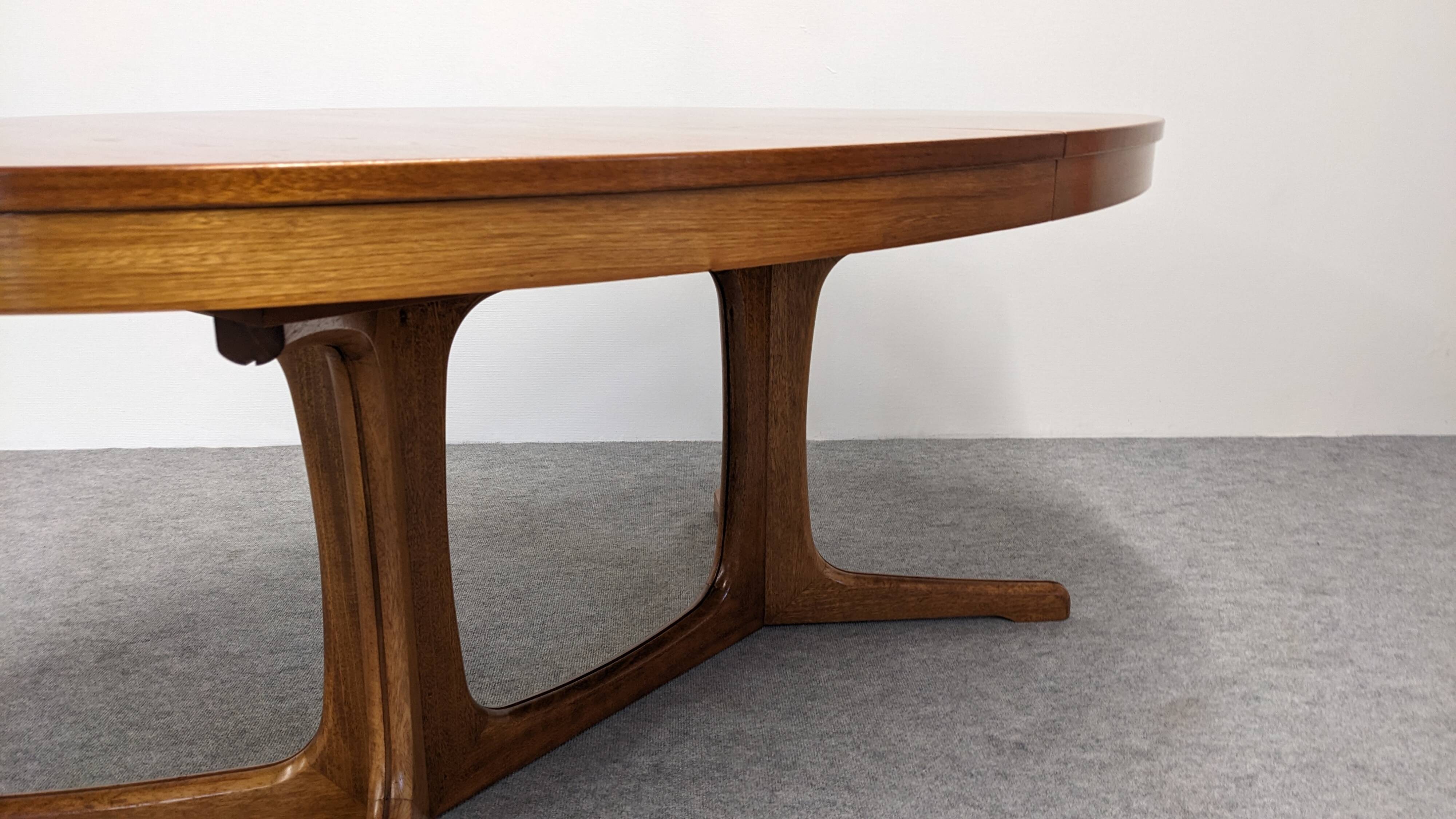 Oval extendable dining table by Baumann, France circa 1970.