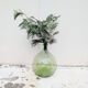 Give me a green glass jug made of blown glass.