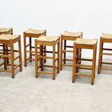 set of seven rattan and wood barstools