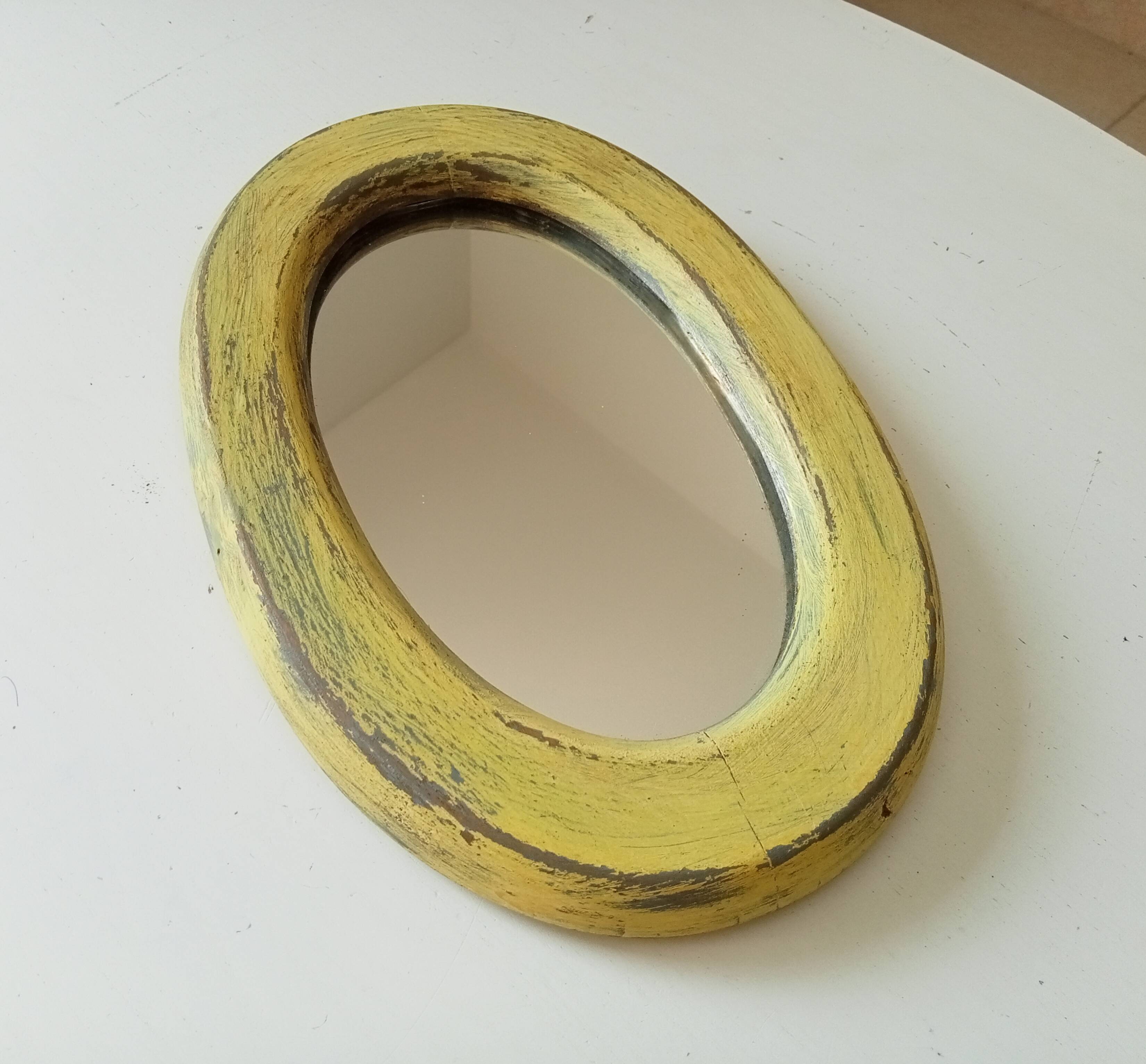 Small antique oval mirror