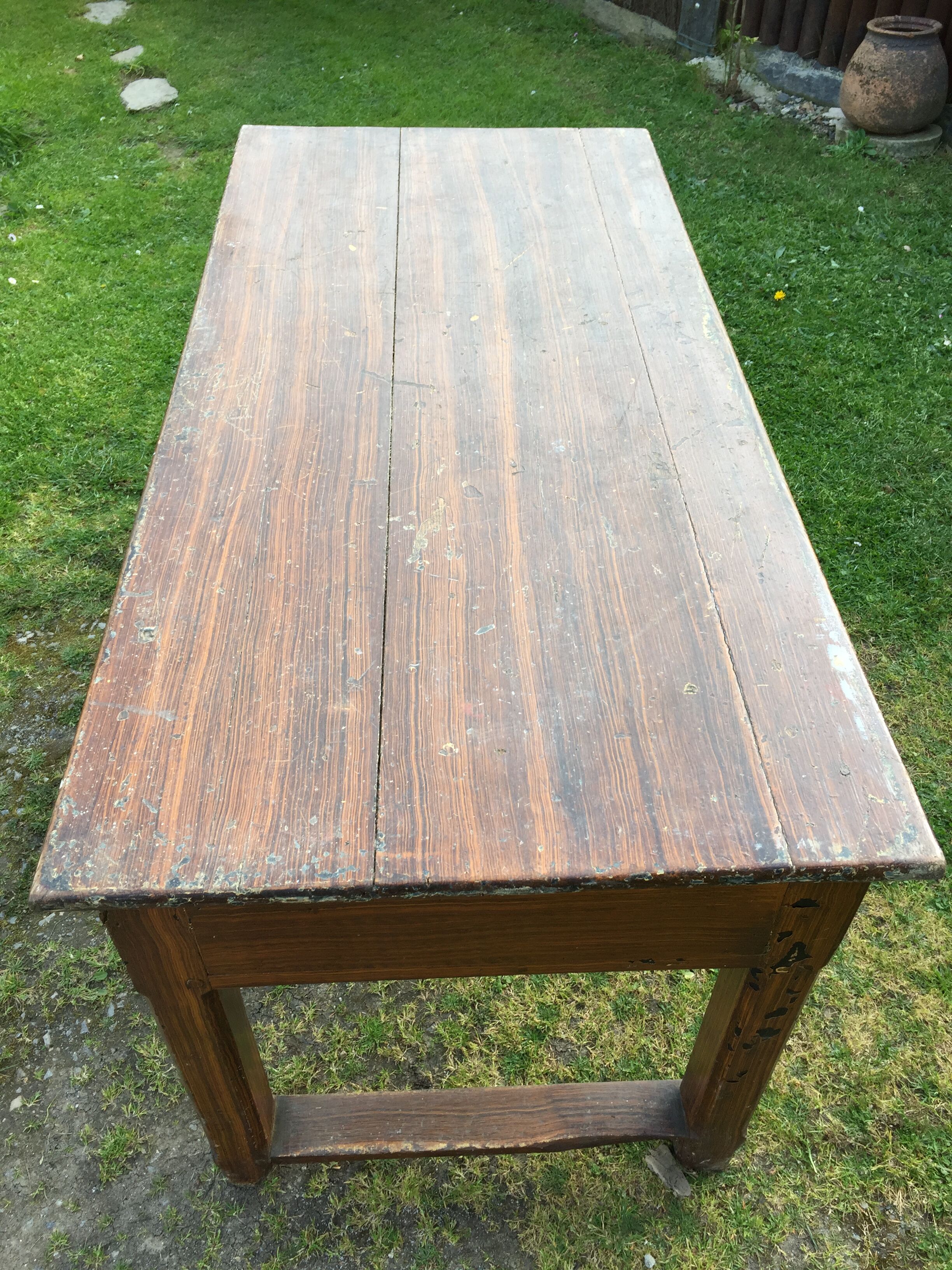 Old farmhouse table in oak painted faux wood old painting.