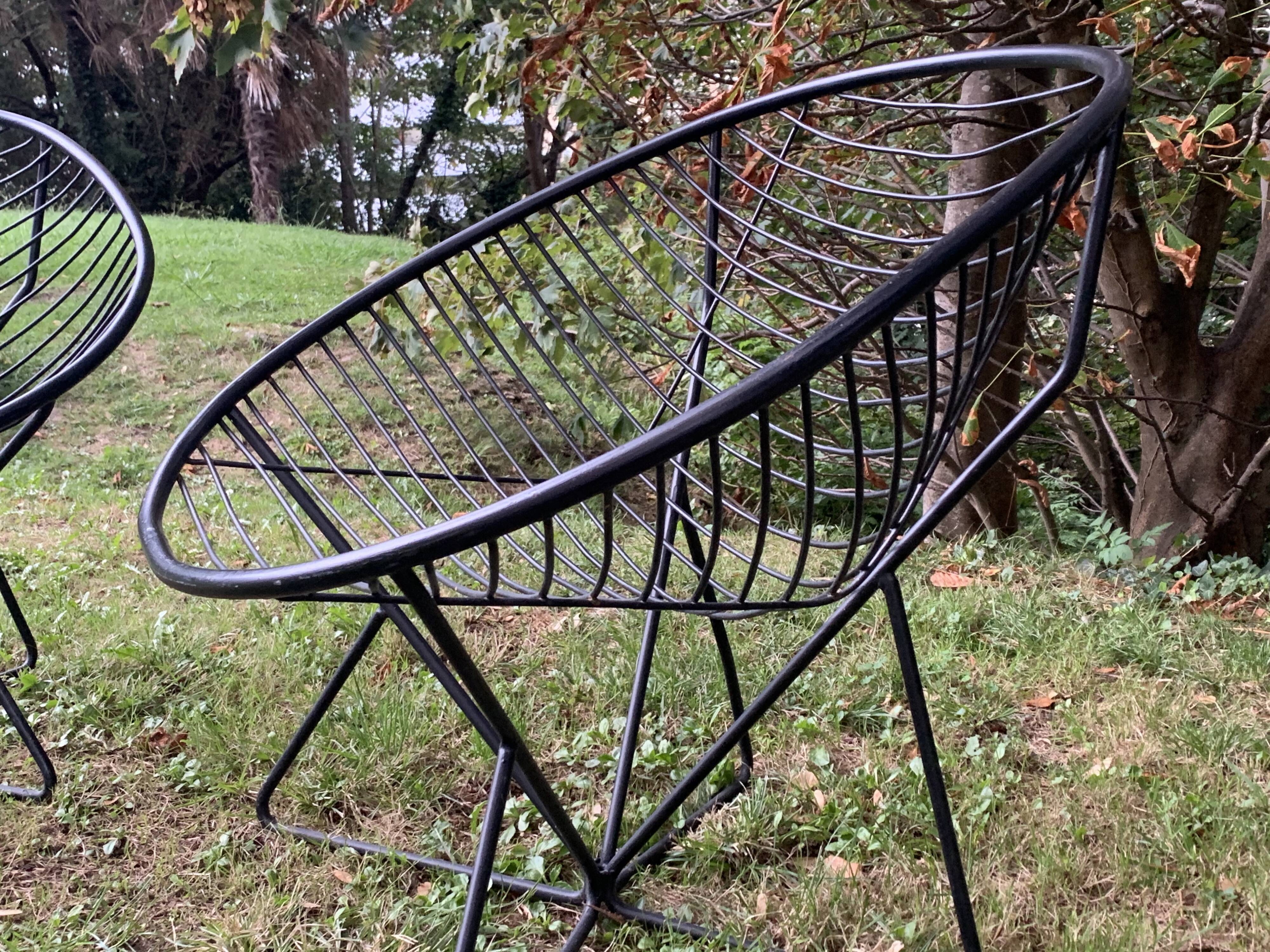 Pair of round chairs in black tubular steel 1960