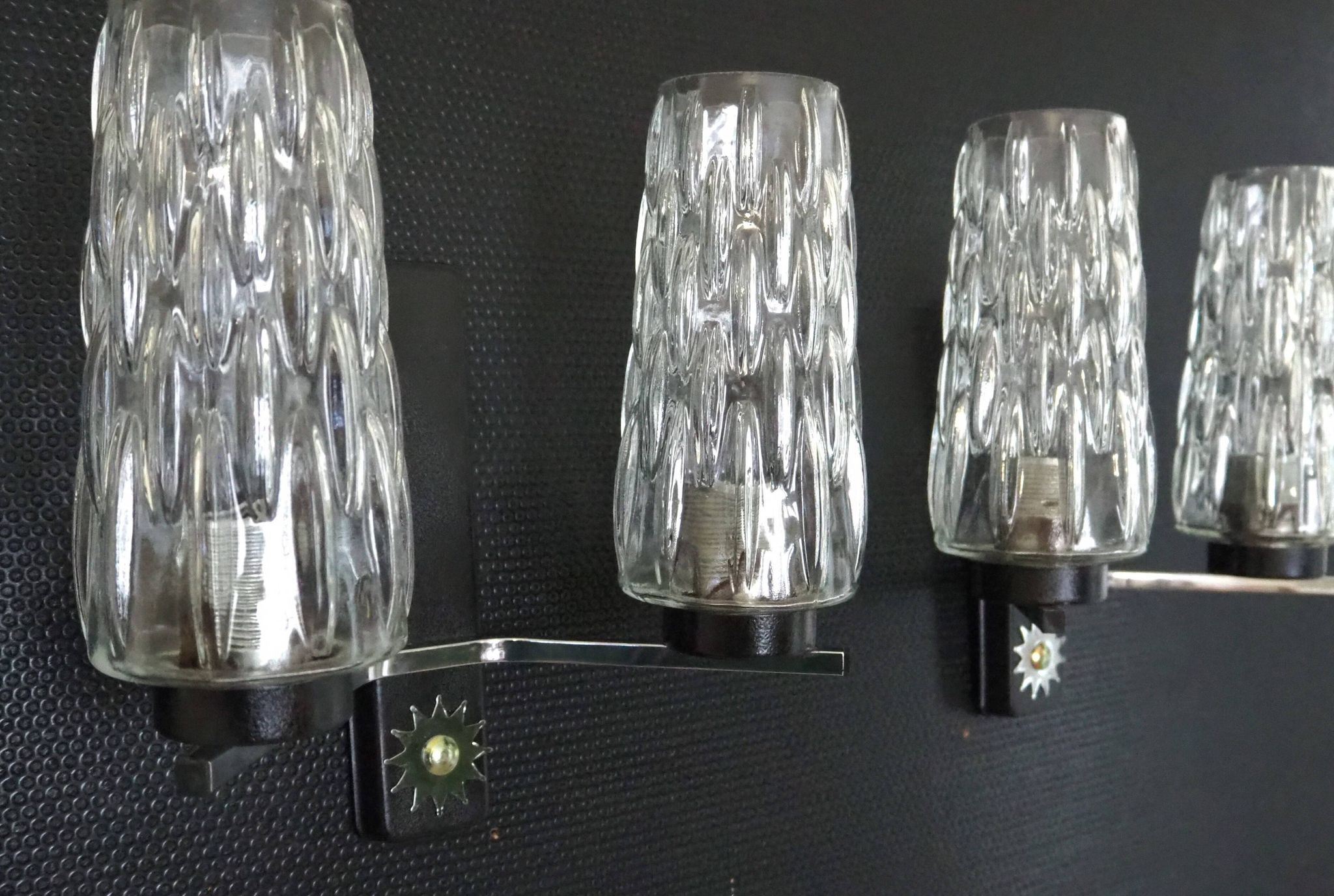 Pair of wall lights from the 1950s-1960s with a push button switch.