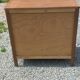 Vintage oak commode with tapered legs from the 1950s.