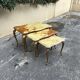 Nest of tables in onyx and brass