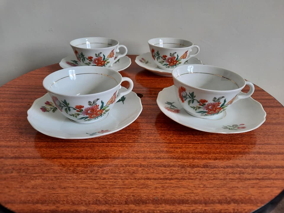 10 porcelain tea cups and 1 milk pot
