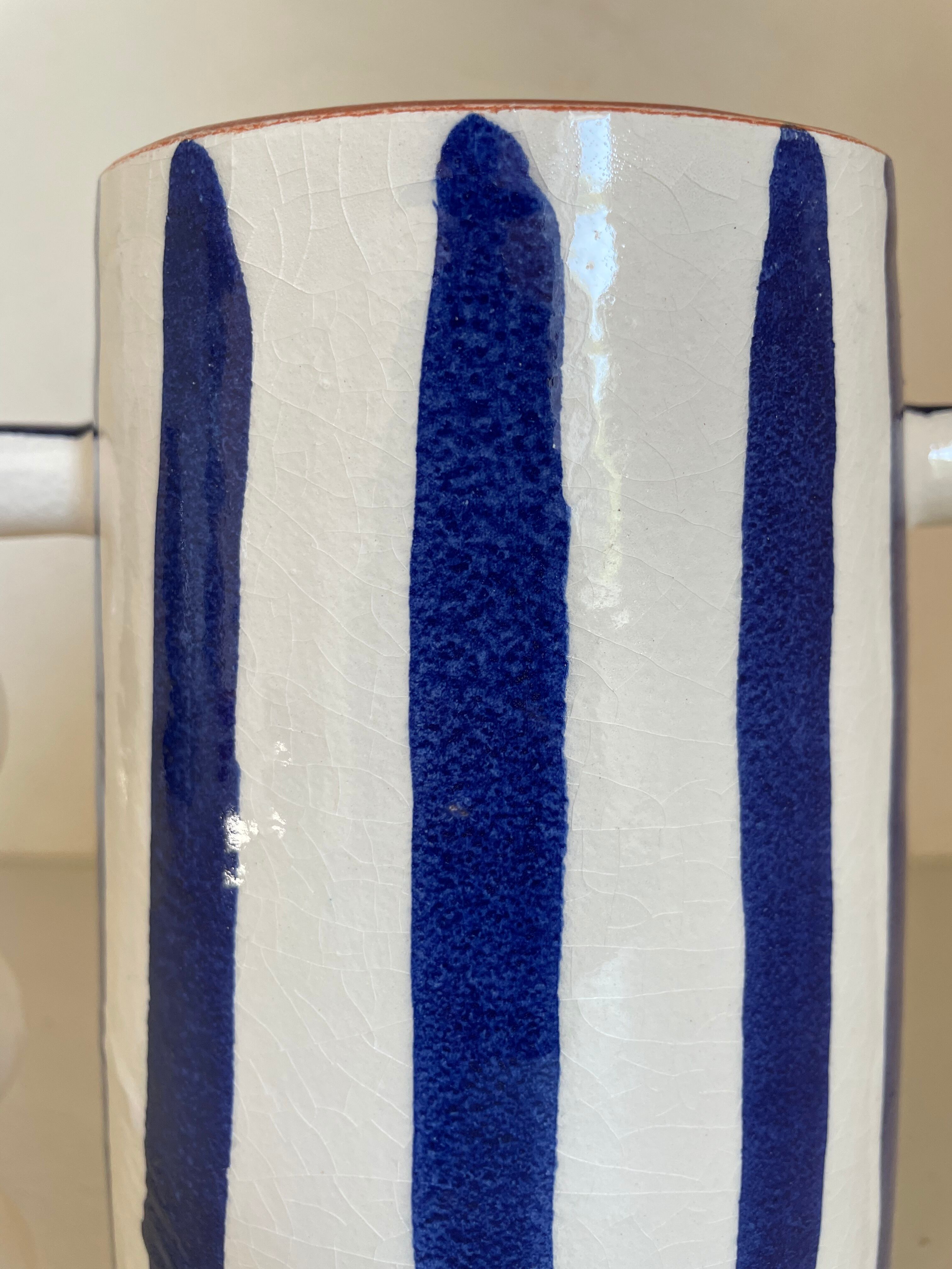 Klein blue and white striped ceramic vase with abstract handmade wavy handles