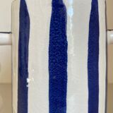 Klein blue and white striped ceramic vase with abstract handmade wavy handles