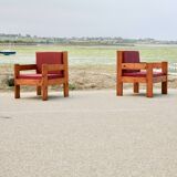 Pair of pine fireside chairs, France, 1960s, "raspberry" cushions