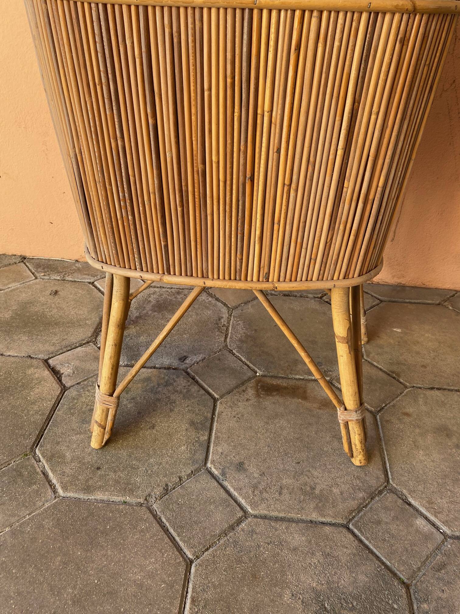 Vintage rattan bar from the 60s with rounded shapes and a shelf for glasses