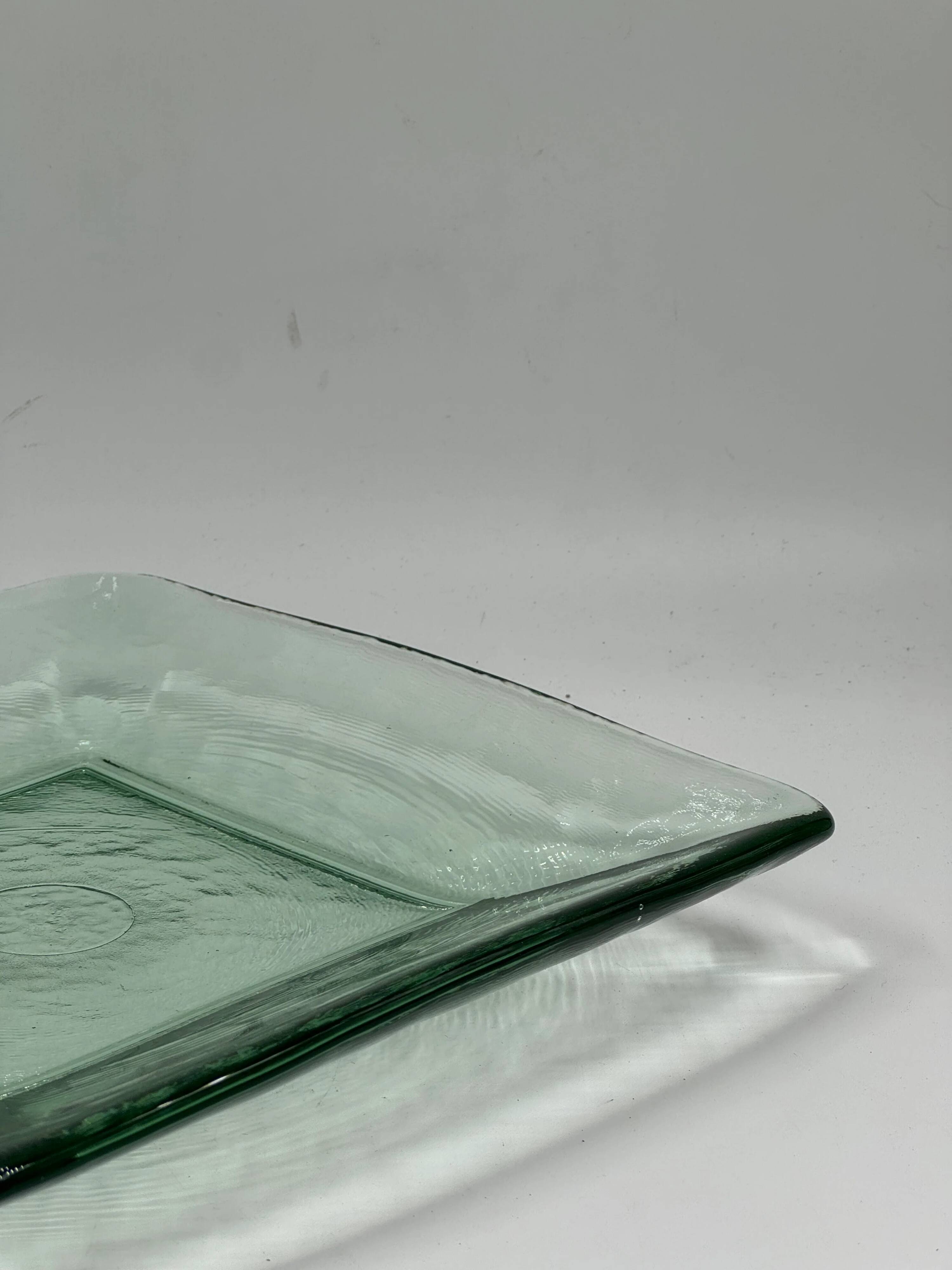 Square sculptural glass plate, textured wavy finish.