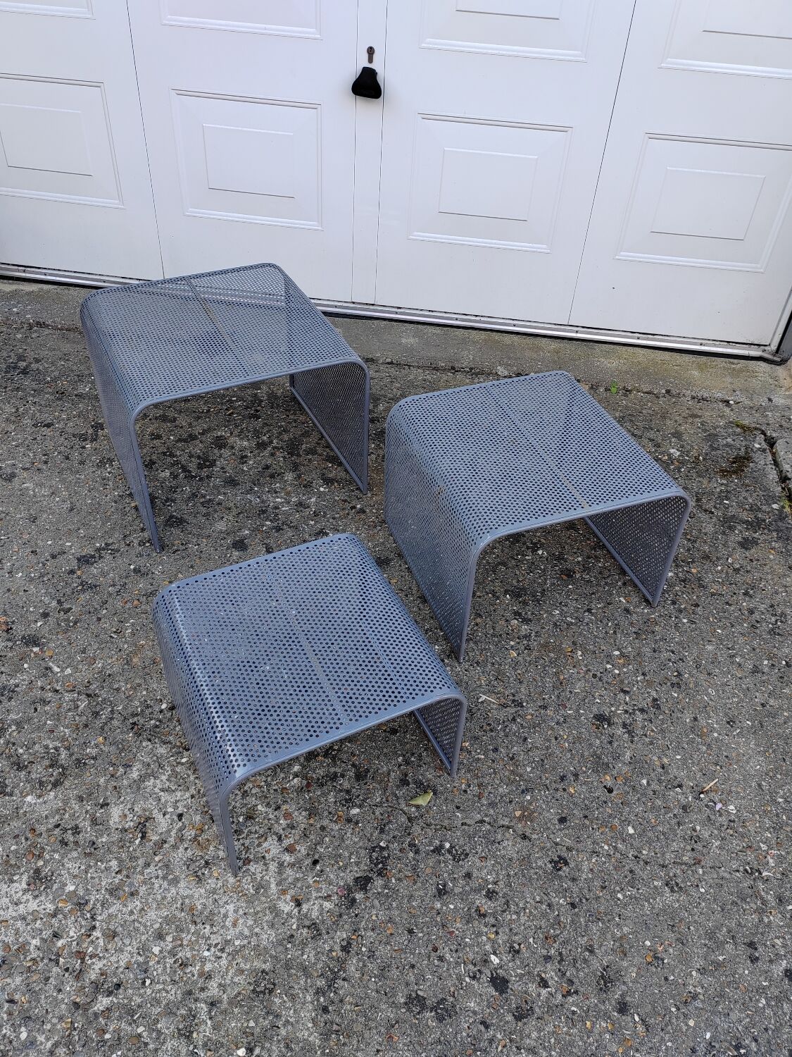 Nested tables with perforated metal from the 1980s.