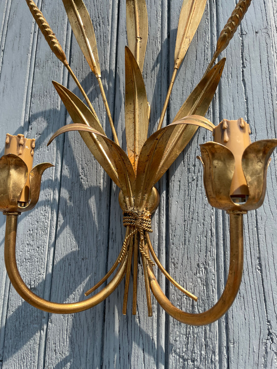 Pair of wall sconces in the shape of a wheat sheaf with two lights.