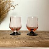 6 small pink glasses with black stems