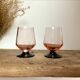 6 small pink glasses with black stems