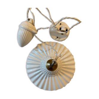 Suspension monte et baisse en porcelaine