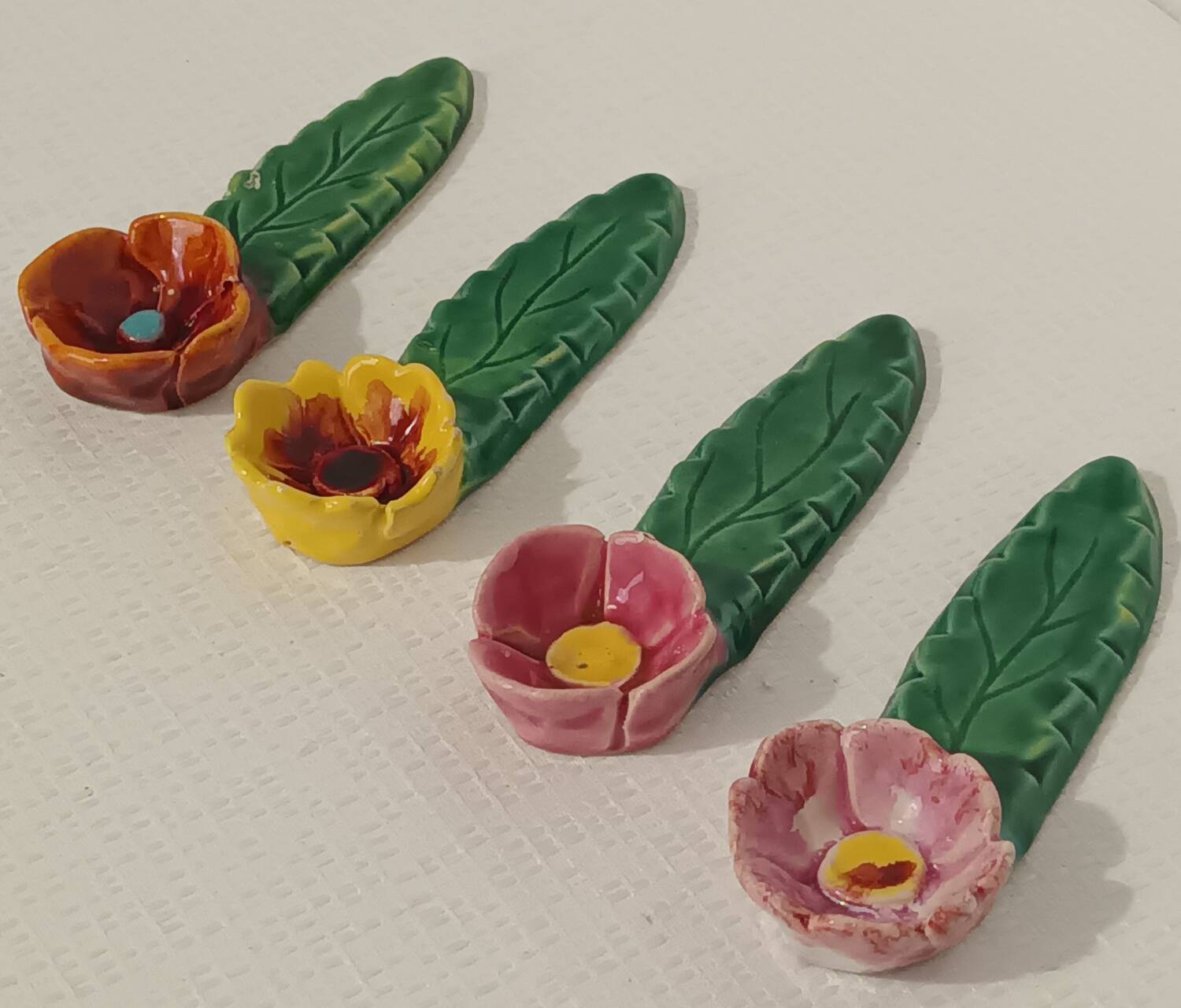 4 vintage signed flower knife rests