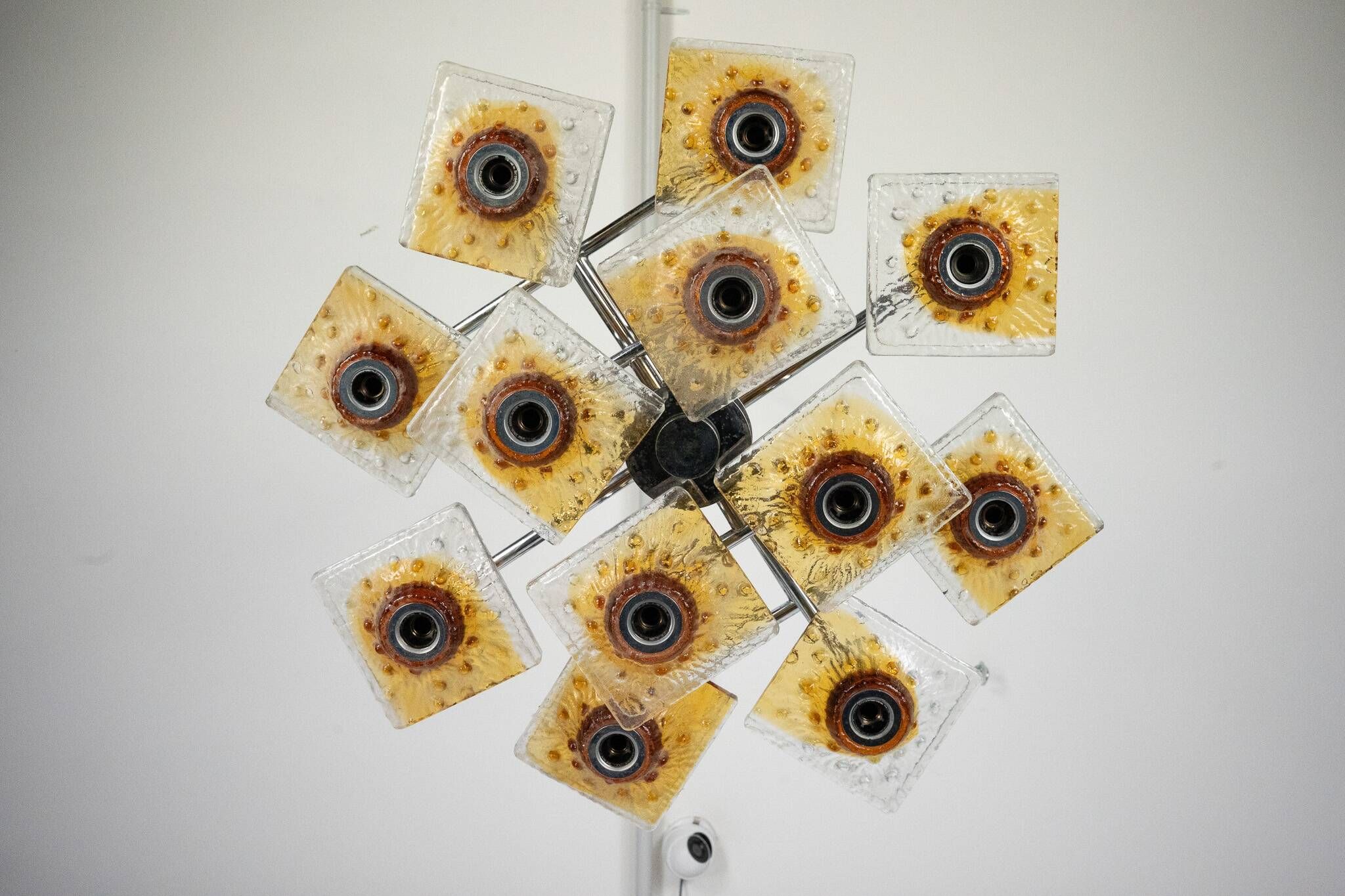 12-light Mazzega chandelier in amber and clear murano glass and chrome. Ita